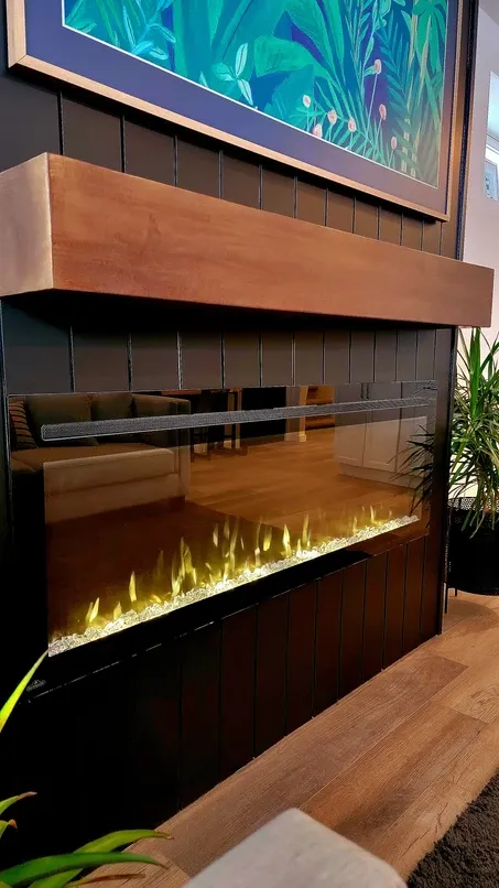 photo of a fireplace in the Fieldhouse basement, designed and built by KMA Building in Winnipeg, MB