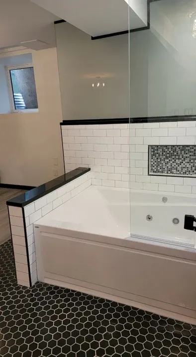 photo of a bathtub in the Marshal basement, designed and built by KMA Building in Winnipeg, MB