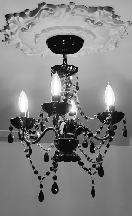 photo of a chadelier in the Marshal basement, designed and built by KMA Building in Winnipeg, MB